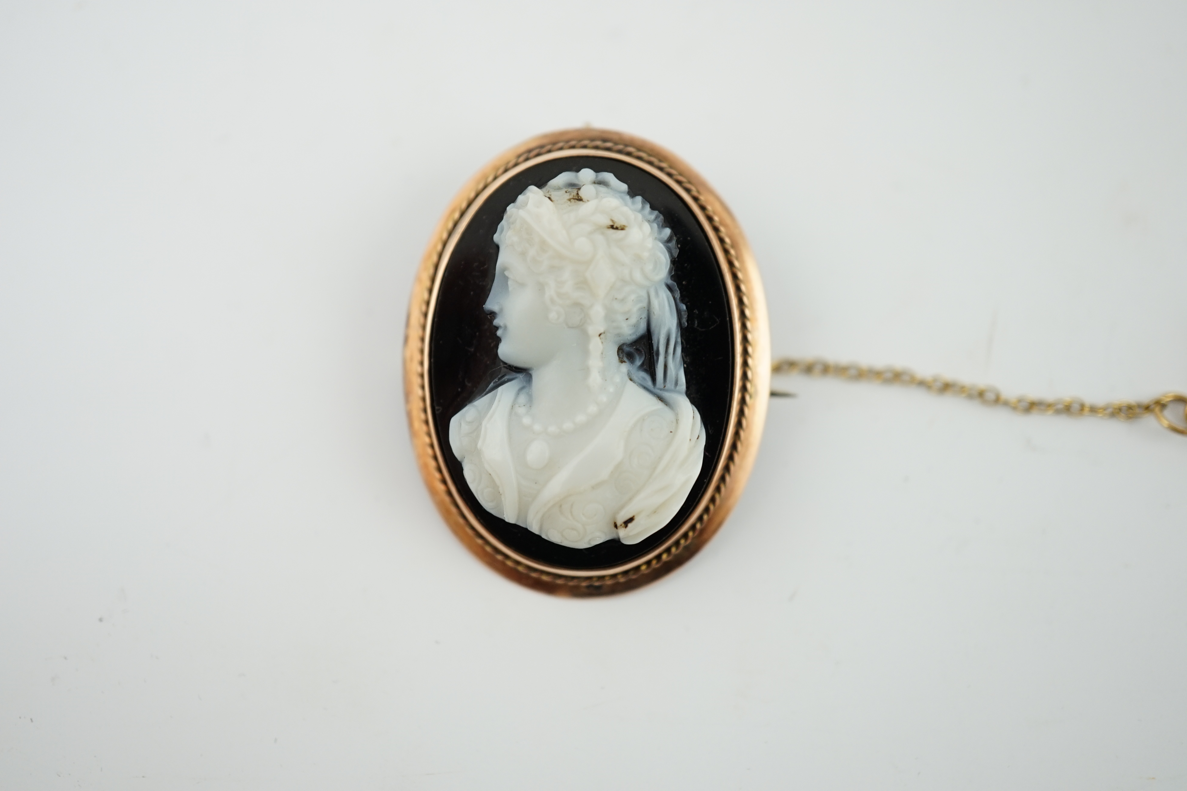 A Victorian 9ct gold mounted oval sardonyx cameo set brooch